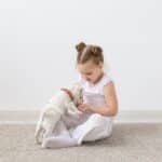 Pet'S Owner, Children And Dogs Concept - Little Girl Sitting On The Floor With Cute Jack Russell
